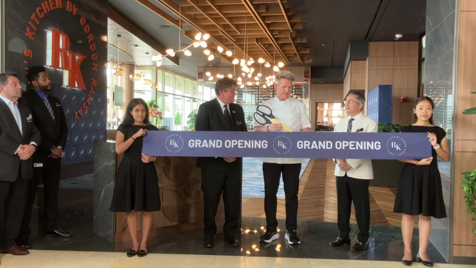 Gordon Ramsay cuts the ribbon at his new restaurant at the Four Seasons Hotel in St. Louis